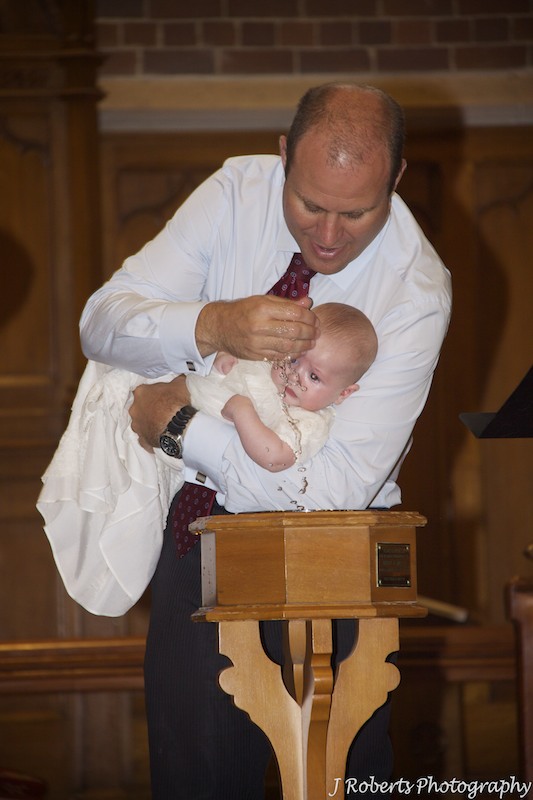 Baby boy being christening - christening photography